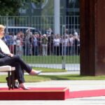 Angela Merkel, sentada junto a la primera ministra danesa, durante ceremonia oficial