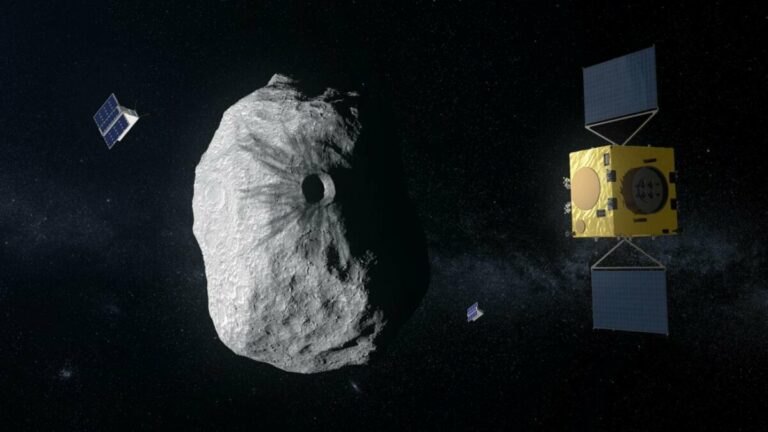 Ilustración de la misión Hera (con sus dos CubeSats) de la Agencia Espacial Europea, dirigida hacia un asteroide binario formado por Didymos (780 m de diámetro) y Dimorphos (160 m). Hera estudiará las secuelas del impacto causado por la nave espacial DART de la NASA en el cuerpo más pequeño. / ESA–ScienceOffice.org