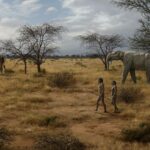 Homo erectus en África oriental rodeado de fauna contemporánea. / ©Mauricio Antón
