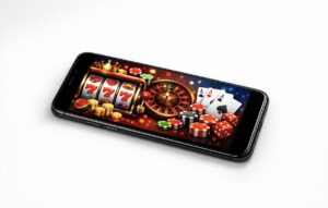 Tel&eacute;fono m&oacute;vil mostrando juegos de casino como tragamonedas y cartas